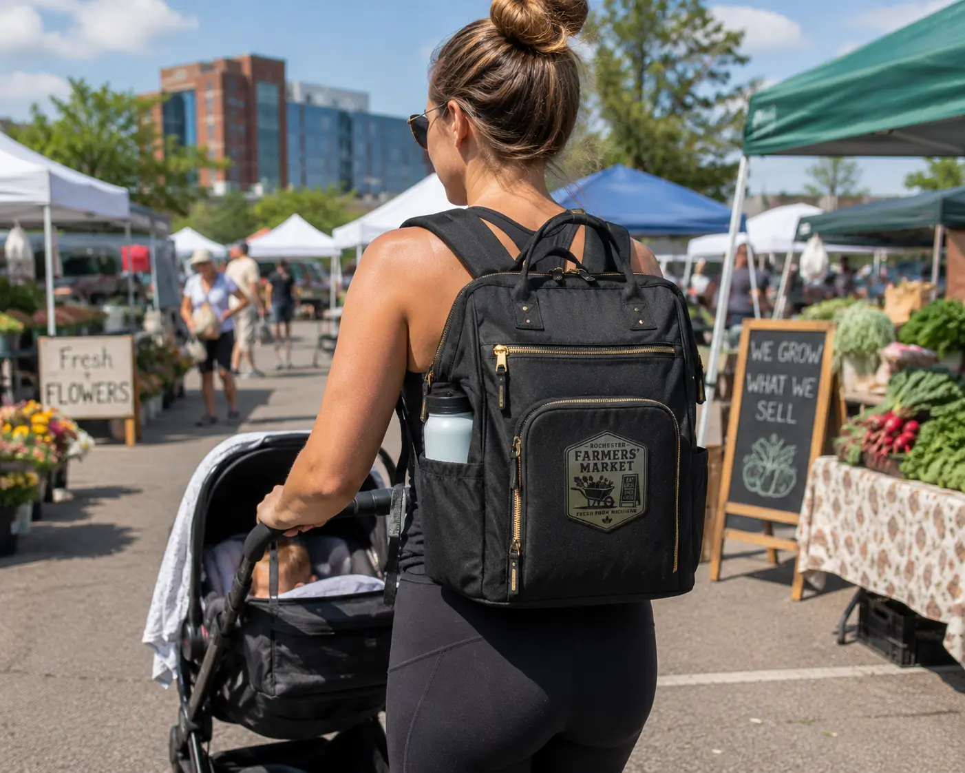 Woman at Rochester Farmers Market with leather sticker on backpack