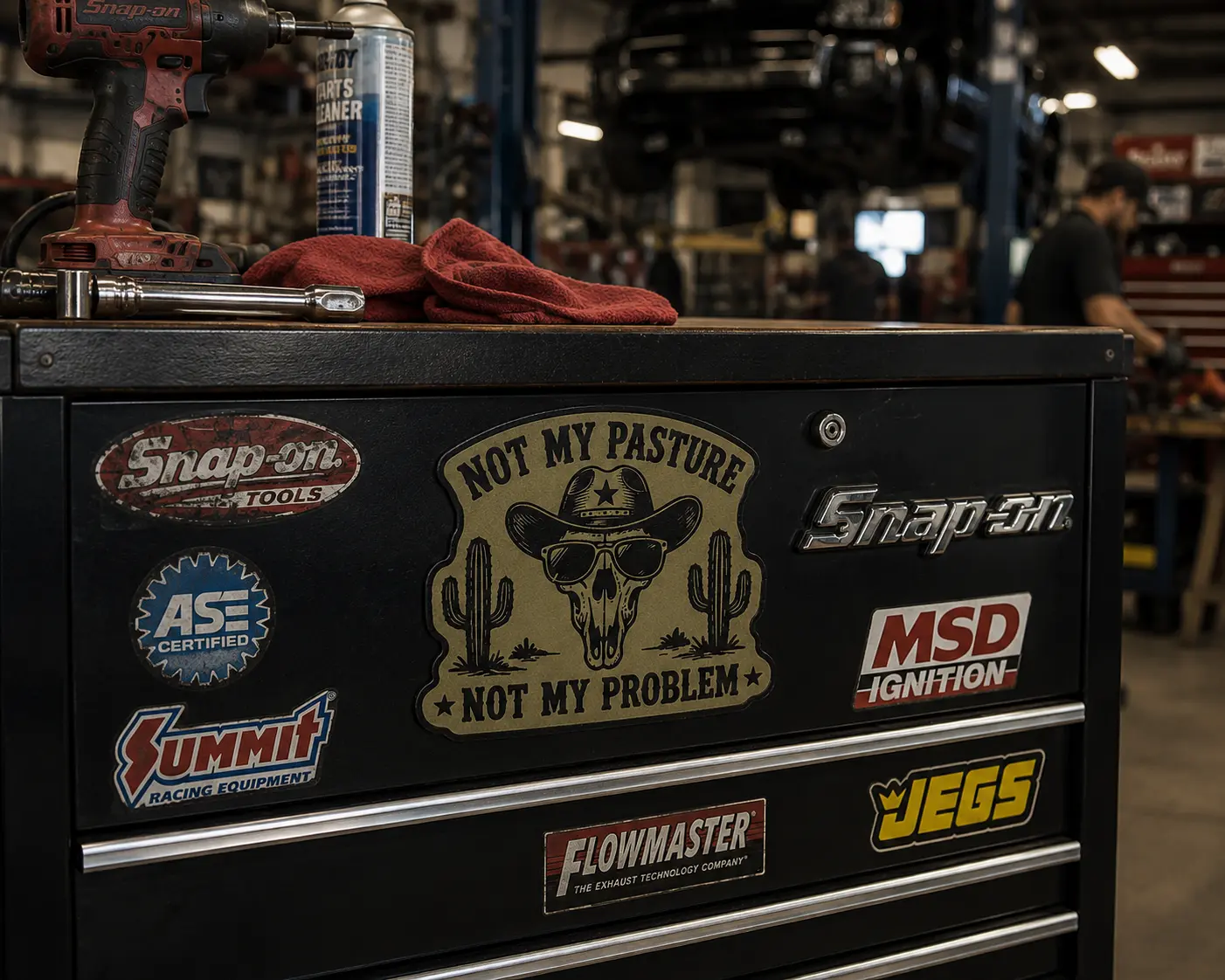 Mechanic toolbox with custom leather sticker in shop